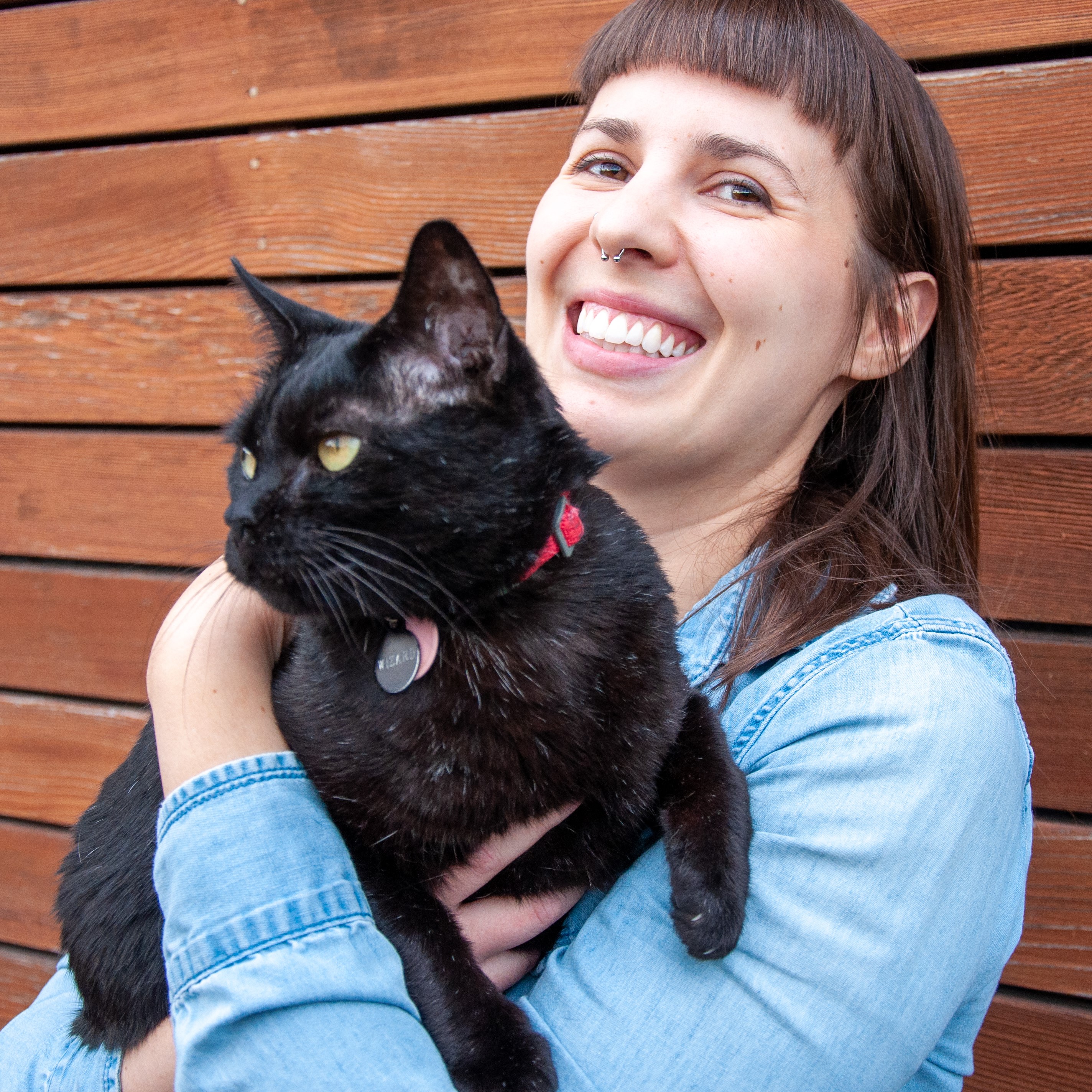 Headshot of Amanda Pirog holding her cat