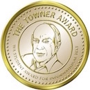 Small image of gold medal that says "The Towner Award" with an engraving of Bill Towner
